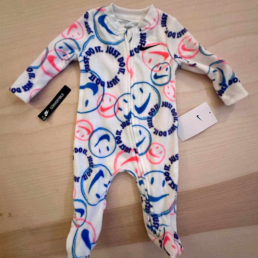 Nike Kids One Piece - White with Pink and Blue Smiley Faces